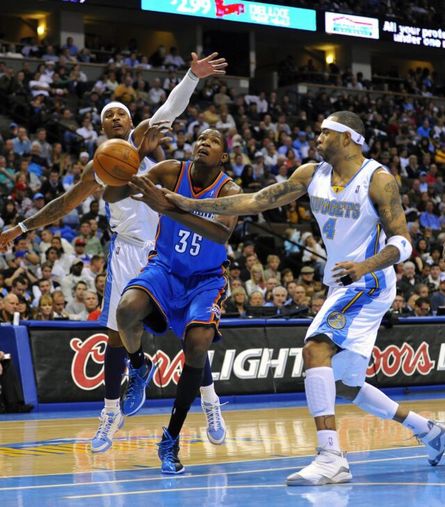 Historical image: Oklahoma City Thunder forward Kevin Durant (35) is fouled by Denver Nuggets forward Kenyon Martin (4) and forward Carmelo Anthony (15) in the second half at the Pepsi Center in 2009. The Nuggets defeated the Thunder 102-93.